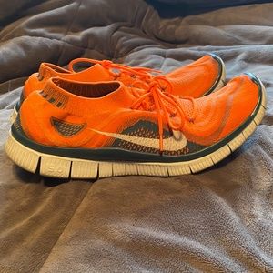 Orange Nike free run flyknit